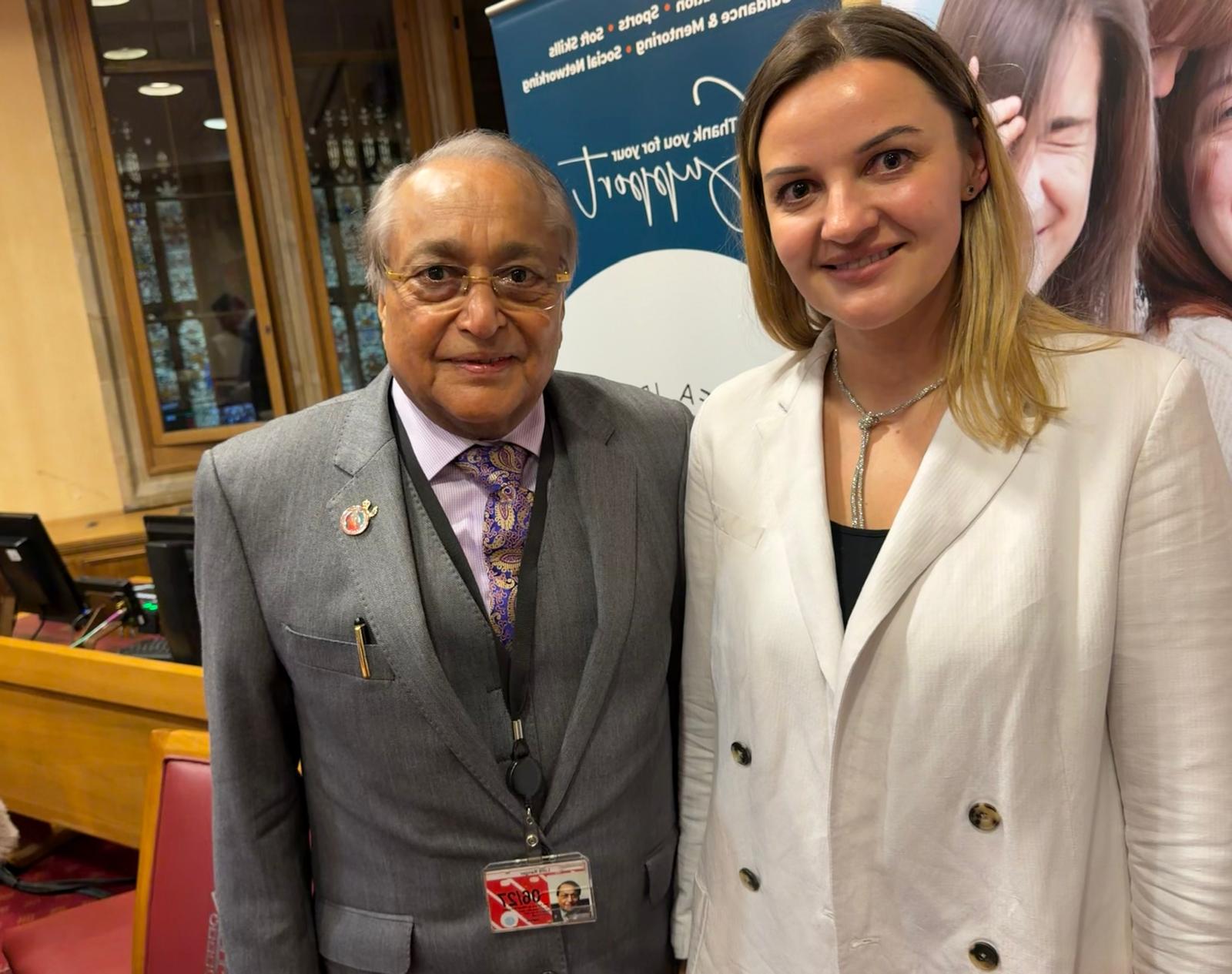 Kristina Culka with a foundation representative during charity work